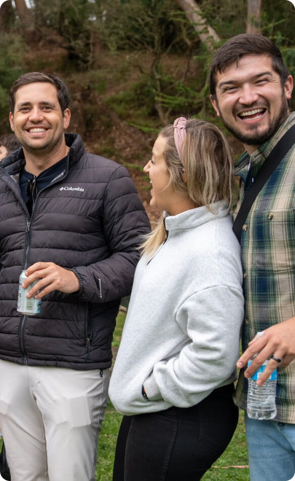 Employees laughing at an outdoor event