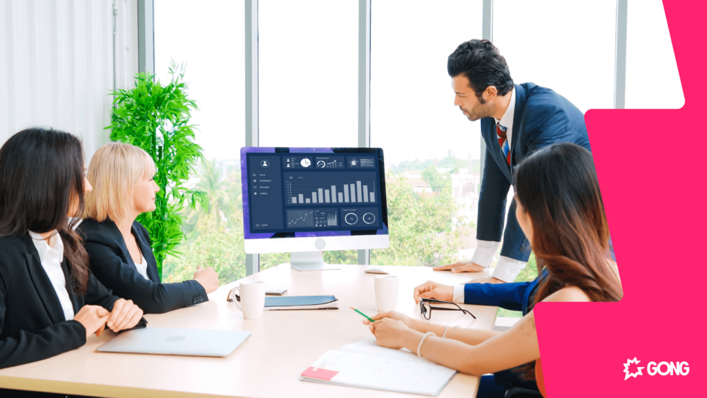 Boardroom of executives viewing an analytics dashboard